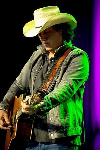 David Lee Murphy playing his Takamine guitar